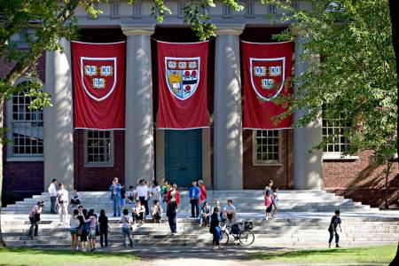 Harvard banners hang outside Memorial Church on the Harvard University campus in Cambridge, Massachusetts, U.S., on Friday, Sept. 4, 2009. (Michael Fein/Bloomberg via Getty Images)