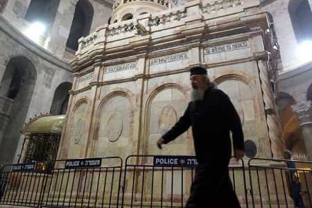 A priest walks outside the tomb of Jesus Christ  in the Church of the Holy Sepulchre on March 21, 2017 in Jerusalem, Israel. (Lior Mizrahi/Getty Images)