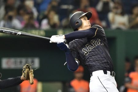 Japan's baseball star Shohei Ohtani hits a double in the seventh inning during the game between Japan and the Netherlands at the Tokyo Dome on November 13, 2016. (KAZUHIRO NOGI/AFP/Getty Images)