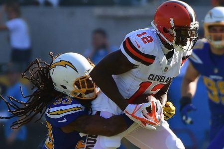 Tre Boston #33 of the Los Angeles Chargers tackles Josh Gordon #12 of the Cleveland Browns during the first quarter of the game. (Harry How/Getty Images)