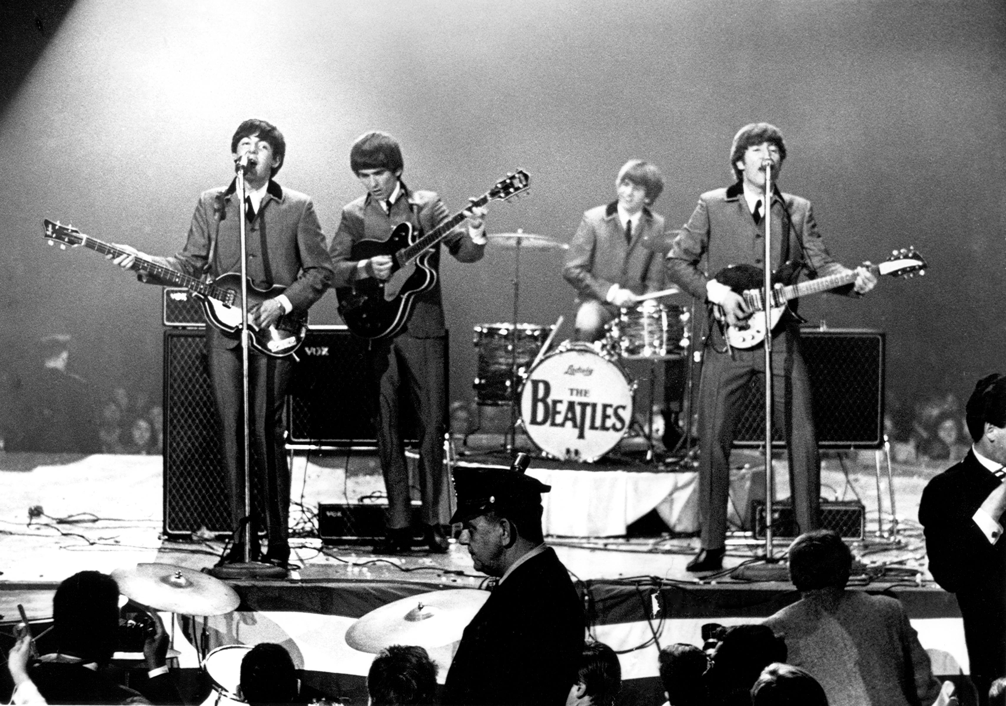 The Beatles perform onstage at the Washington Coliseum on February 11, 1964 in Washington, D.C.   (Photo by Michael Ochs Archives/Getty Images)