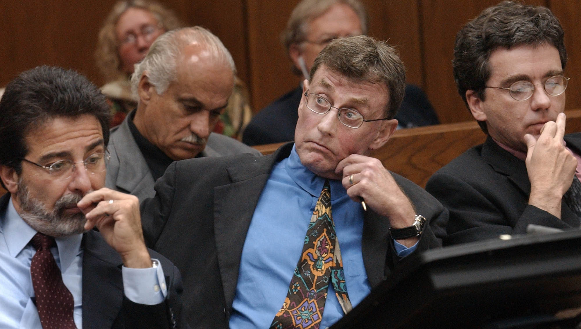 Michael Peterson watches as prosecutor David Saacks, not pictured, argues why gay pornography and e-mail soliciting sex with another man taken from  Peterson's home computer should be presented to the jury during Peterson's murder trial, Thursday Aug. 7, 2003, in Durham, N.C. (AP Photo/Chuck Liddy, Pool)