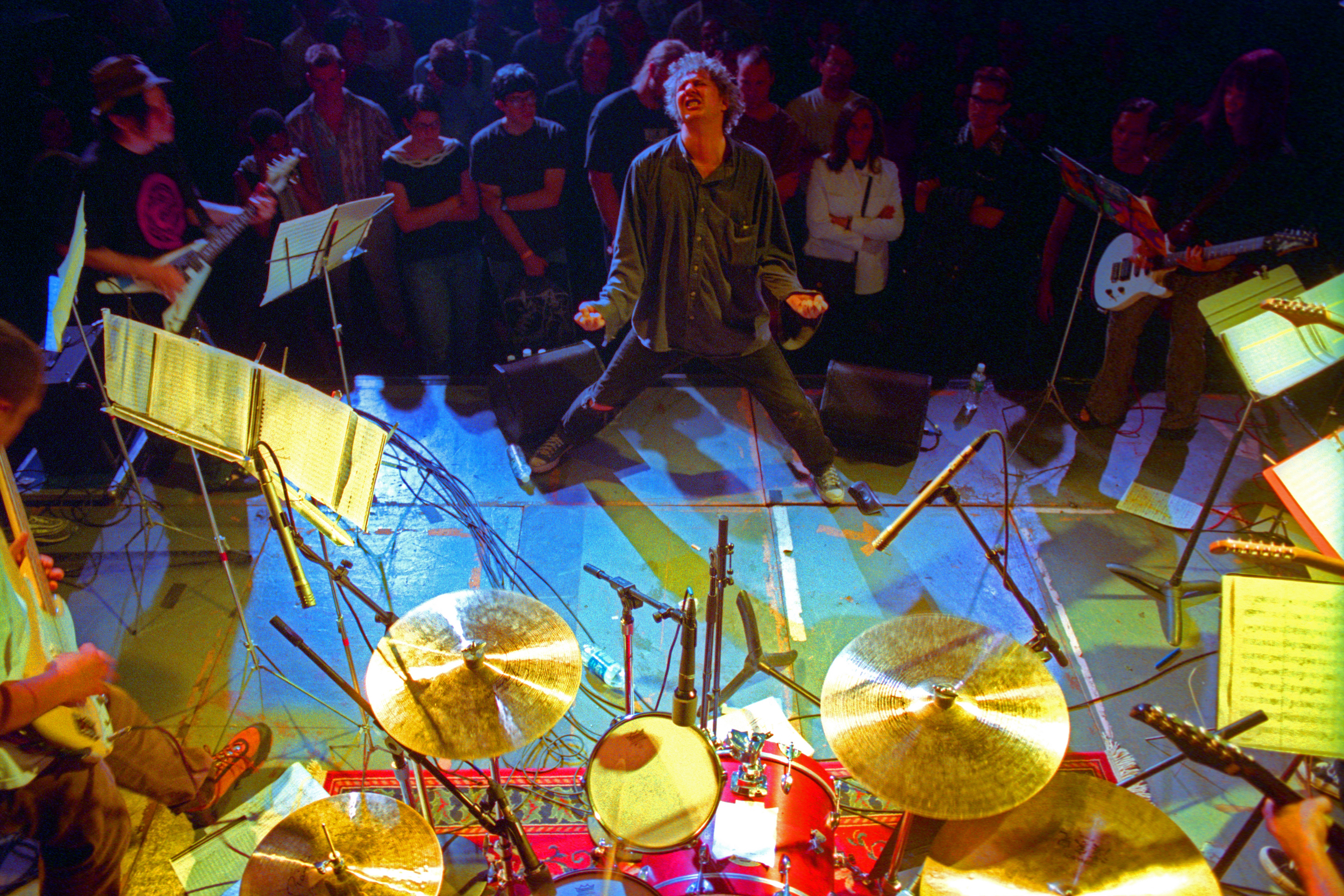 Glenn Branca conducting his ensemble at the Anchorage in Brookyn on Thursday night, July 20, 2000.(Hiroyuki Ito/Getty Images)