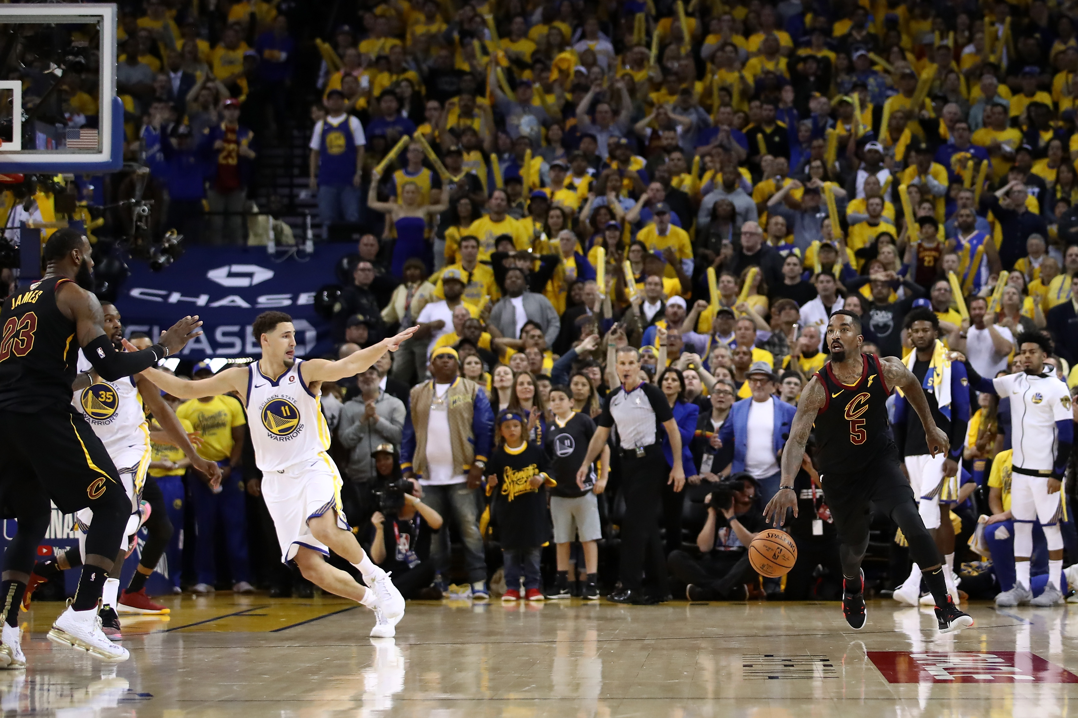 JR Smith #5 of the Cleveland Cavaliers dribbles in the closing seconds of regulation as LeBron James #23 attempts direct the offense against the Golden State Warriors  in Game 1 of the 2018 NBA Finals at ORACLE Arena on May 31, 2018 in Oakland, California. (Photo by Ezra Shaw/Getty Images)