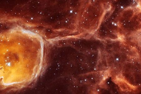 In this unusual image, NASA's Hubble Space Telescope captures a rare view of the celestial equivalent of a geode -- a gas cavity carved by the stellar wind and intense ultraviolet radiation from a hot young star (Photo by NASA/WireImage)