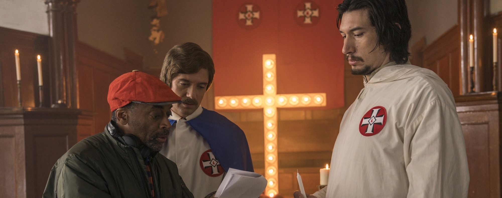 (l-r.) Director Spike Lee, actors Topher Grace and Adam Driver on the set of Spike Lee’s "BlacKkKlansman."
(David Lee / Focus Features)