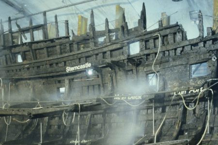 The wooden wreck of the Mary Rose warship is kept wet whilst undergoing conservation in the ship hall, Portsmouth July 1987. The Mary Rose was salvaged from the sea bed in 1982. (Photo by RDImages/Epics/Getty Images)