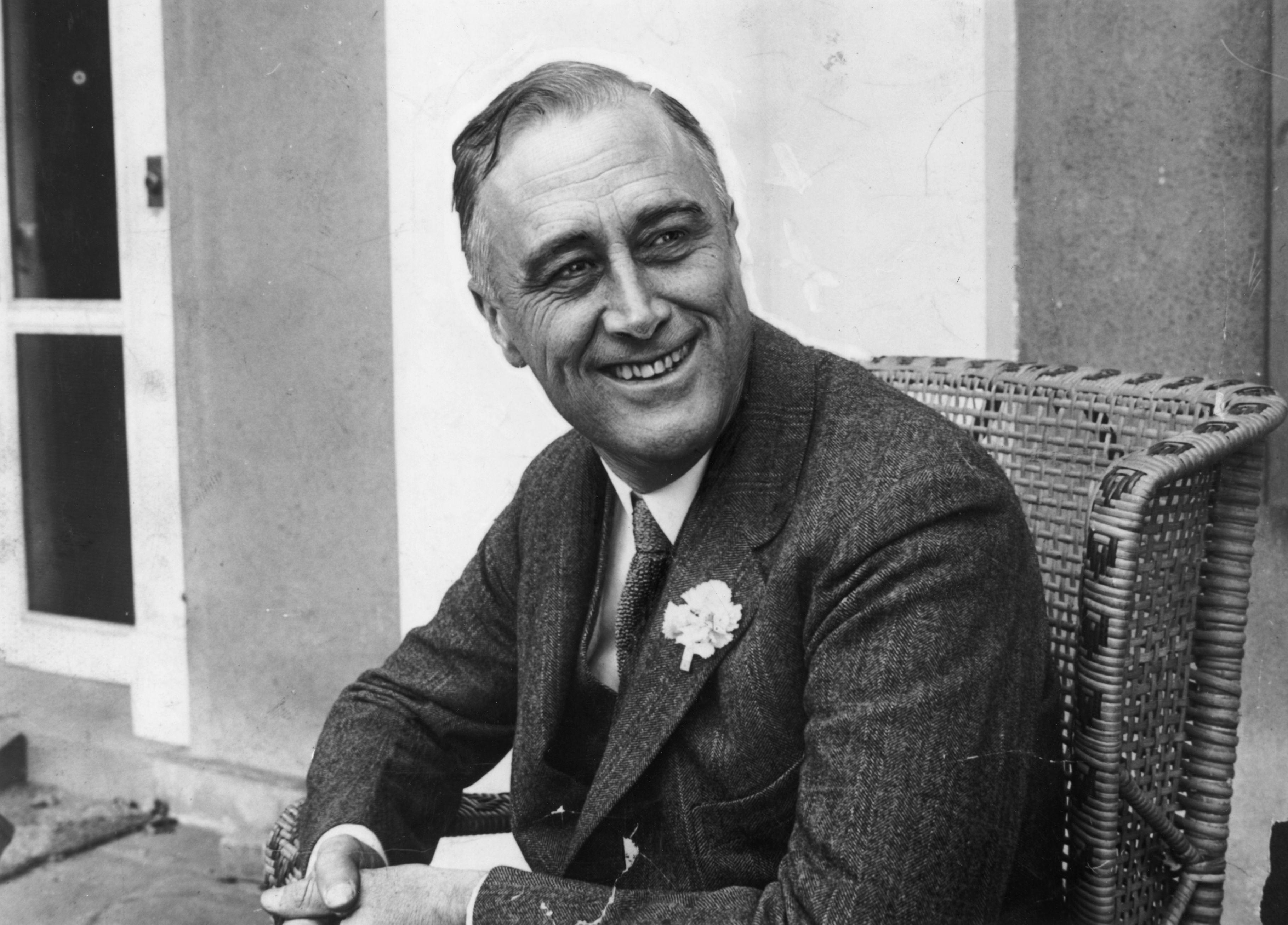 American statesman Franklin Delano Roosevelt (1882 - 1945) smiling when he heard that he was leading the contest for Governor of New York State. He later became the 32nd President of the USA.  (Photo by Hulton Archive/Getty Images)