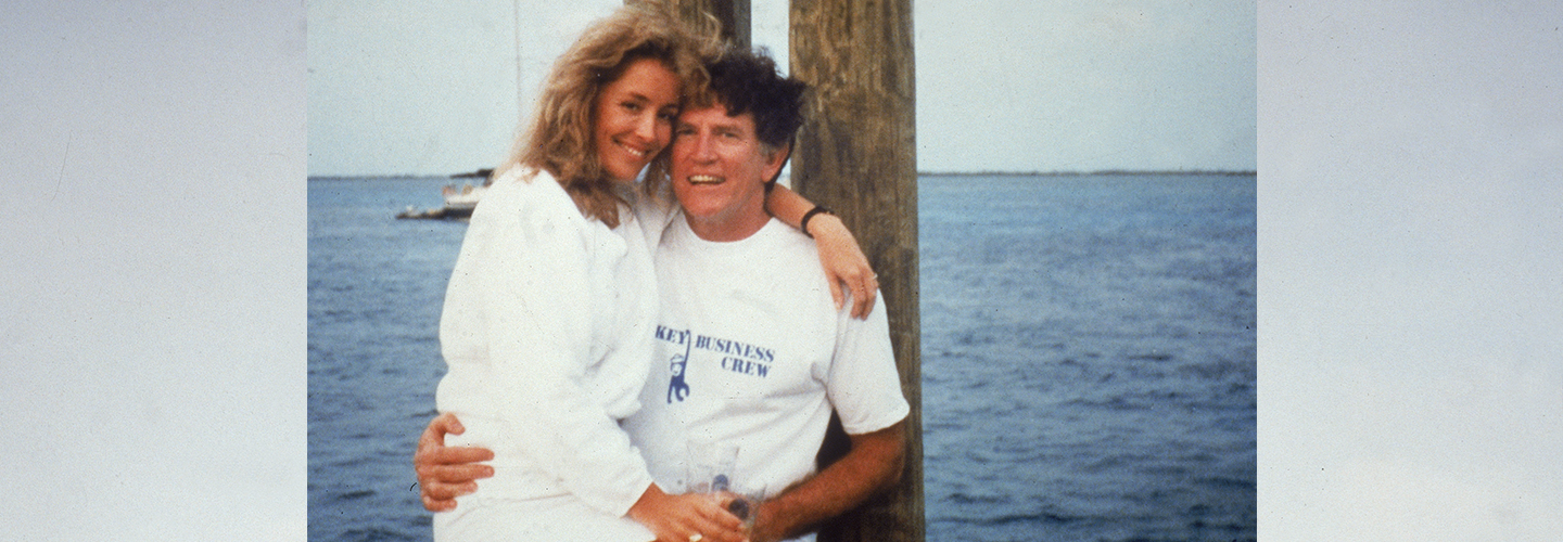 American politician Gary Hart sits on a dock with Donna Rice on his lap, 1987. (Photo by National Enquirer/Getty Images)