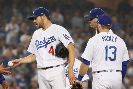 Los Angeles Dodgers manager Dave Roberts takes the ball from Game 4 starter Rich Hill in the 2018 World Series on October 27, 2018. (Photo credit: Sean M. Haffey, Getty Images)