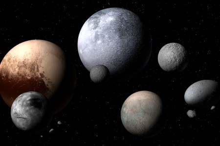 Dwarf planets and moons, illustration. A dwarf planet is a planetary mass object orbiting the Sun that is not a true planet. The discovery of a new dwarf planet, nicknamed "the Goblin" was recently announced. (Photo by MARK GARLICK/SCIENCE PHOTO LIBRARY/Getty Images)