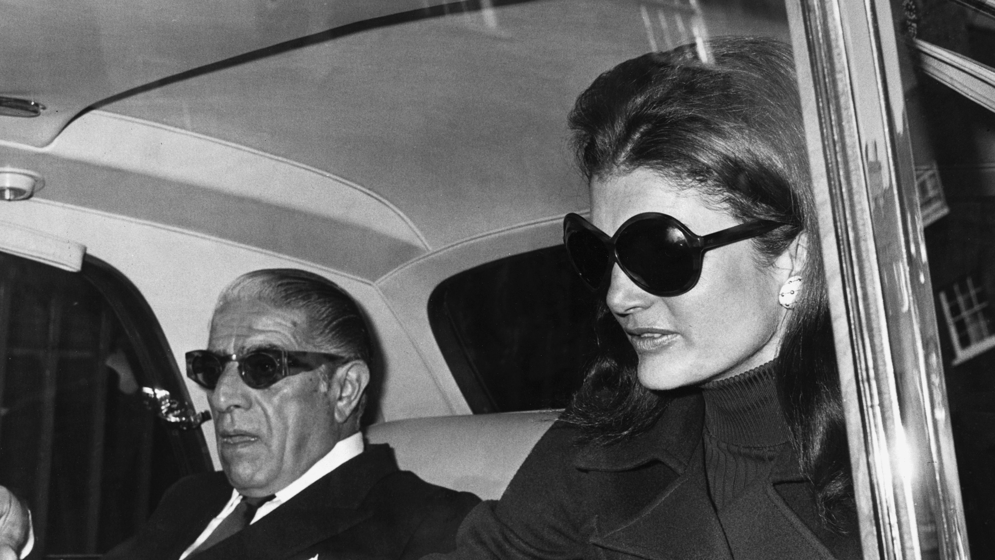 Aristotle Onassis with his wife Jacqueline Kennedy Onassis, just before flying from London to Belfast. 1970. President John F. Kennedy's widow remarried in 1968. (Hulton-Deutsch Collection/CORBIS/Corbis via Getty Images)