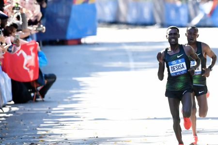 In the final stretch of the 2018 New York City Marathon, Ethiopia's Lelisa Desisa sprints ahead of Sharu Kitata on the way to winning the race by two seconds, with a time of 2:05.59. (Photo by Sarah Stier/Getty Images)