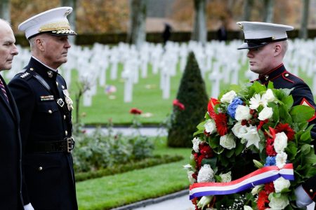 General Joseph Dunford (second from left)) and retired Marine Corps general and current White House Chief of Staff John F. Kelly visit the Aisne-Marne American Cemetery and Memorial in Belleau, France, on November 10, 2018 as part of commemorations marking the 100th anniversary of the 11 November 1918 armistice, ending World War I. Due to logistical difficulties caused by rain, President Trump did not attend. (Photo credit: GEOFFROY VAN DER HASSELT/AFP/Getty Images)