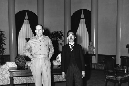 Emperor Hirohito is received by General Douglas MacArthur, U.S. commander of the Japanese occupation, at the U.S. embassy in Tokyo. The Emperor is attired in morning clothes for this precedent-shattering visit. September 1945. (Photo by © CORBIS/Corbis via Getty Images)