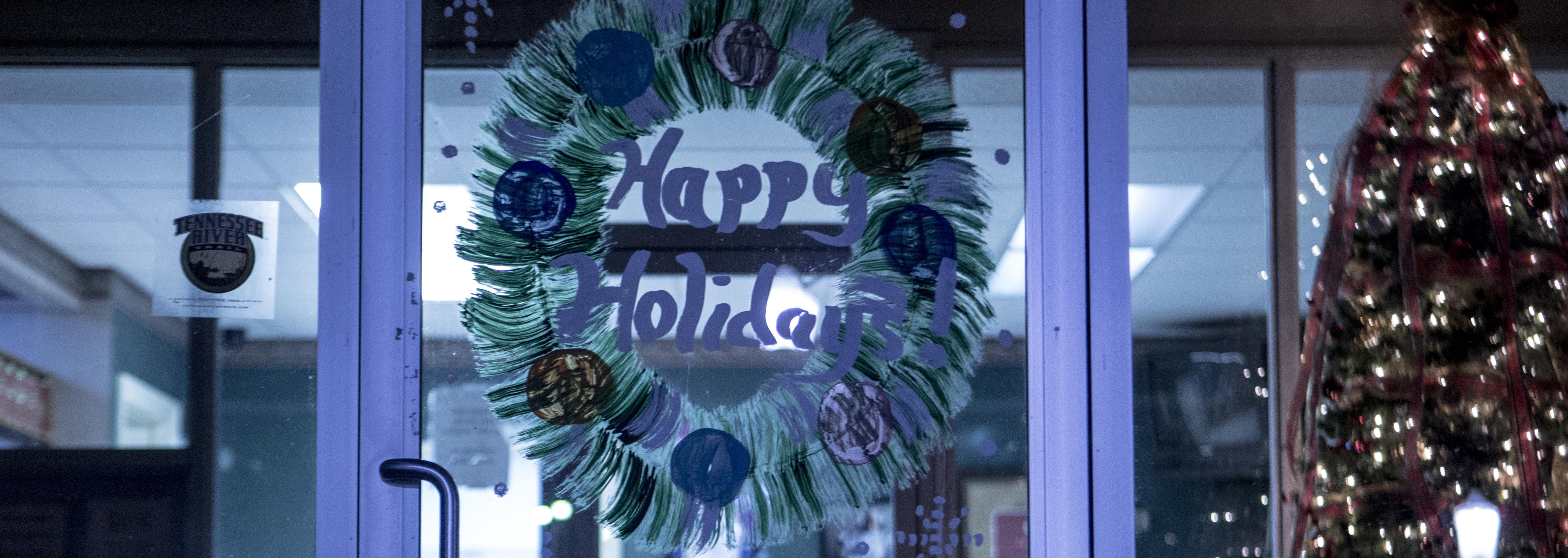 The Town of Linden's City Hall had a lit up sign wishing a "Merry Christmas" while the front door had a hand drawn "Happy Holidays" decorating it.  (Andrea Morales for The Washington Post via Getty Images)