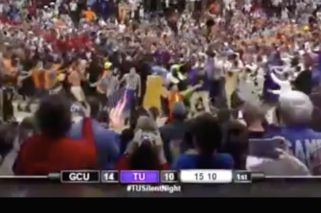 Screenshot of Taylor University fans storming the court during the school's annual "Silent Night" game. (Photo: ESPN)