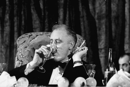 Pres. Franklin Roosevelt drinking white wine as he listens to Speaker Bankhead Jackson Day dinner speech during a Democratic fundraiser. FDR won four presidential elections. (Thomas D. Mcavoy/The LIFE Picture Collection/Getty Images)