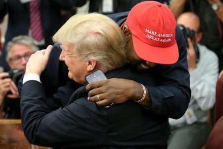 WASHINGTON, DC - OCTOBER 11: U.S. President Donald Trump hugs rapper Kanye West during a meeting in the Oval office of the White House on October 11, 2018 in Washington, DC. (Photo by Oliver Contreras - Pool/Getty Images)