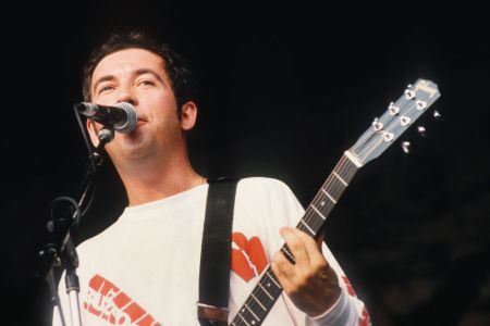 English singer, songwriter and guitarist Pete Shelley (1955 - 2018) of The Buzzcocks performs at Pukkelpop Festival at Sanicole airport, Hechtel, Belgium, 26th August 1990. (Photo Gie Knaeps/Getty Images)