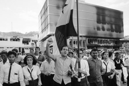 Panamanians march in protest near the Presidential Palace during riots over the sovereignity of Panama Canal Zone, Panama, 1964. (Photo by Michael Rougier/The LIFE Picture Collection/Getty Images)