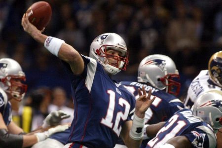 Patriots' Tom Brady throws a touchdown pass in the second quarter. New England Patriots face the St. Louis Rams in Super Bowl XXXVI at the Louisiana Superdome in New Orleans, LA on Feb. 3, 2002. (Photo by Bill Greene/The Boston Globe via Getty Images)