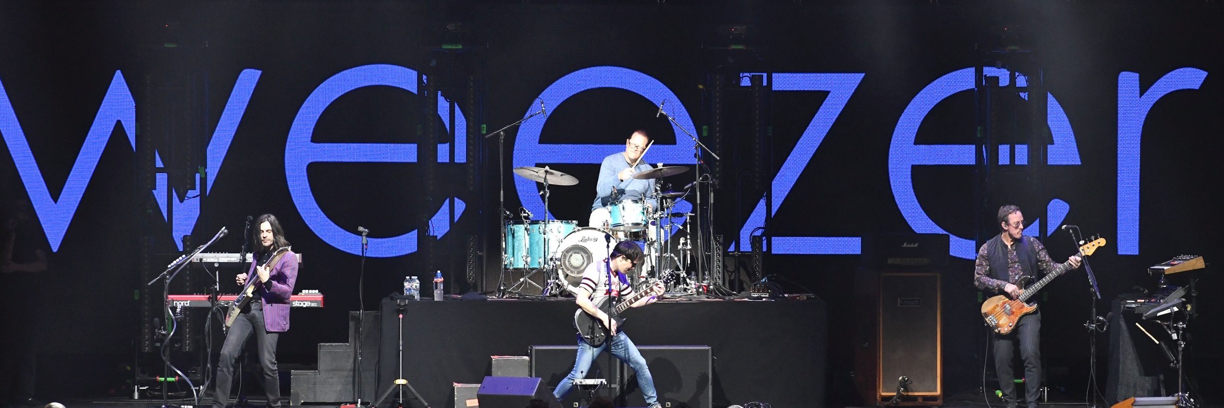 (L-R) Musicians Brian Bell, Patrick Wilson, Rivers Cuomo and Scott Shriner of the band Weezer perform onstage during the iHeartRadio ALTer Ego Show at The Forum on January 19, 2019 in Inglewood, California. (Photo by Scott Dudelson/Getty Images)