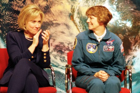 First lady Hillary Rodham Clinton (L) applauds astronaut Eileen Collins during a visit with science students at Dunbar High School March 5, 1998 in Washington, DC. Collins has been named the first woman commander of a NASA mission which will launch in April of 1999. (photo by Karin Cooper)