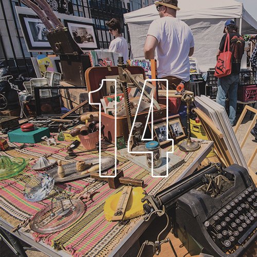 Multiple vintage and antique items scattered on a table in a marketplace, with an overlay of the number "14"