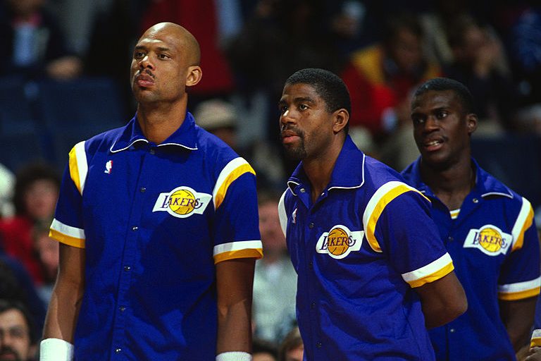 Magic Johnson with Kareem Abdul-Jabbar and Orlando Woolridge. (Photo by Focus on Sport/Getty Images)