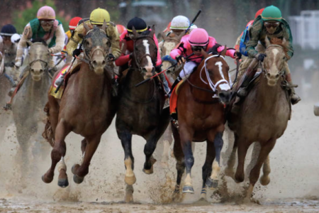 Jockeys fight for position during the 145th running of the Kentucky Derby at Churchill Downs. (Andy Lyons/Getty Images)