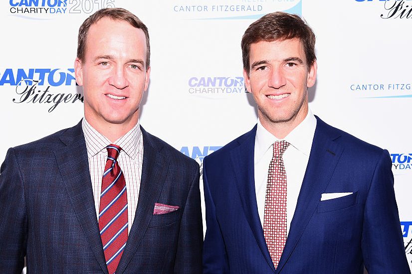 Peyton Manning and Eli Manning in 2016. (Dave Kotinsky/Getty Images for Cantor Fitzgerald)