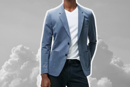 a model in a travel blazer on top of a cloud-like background