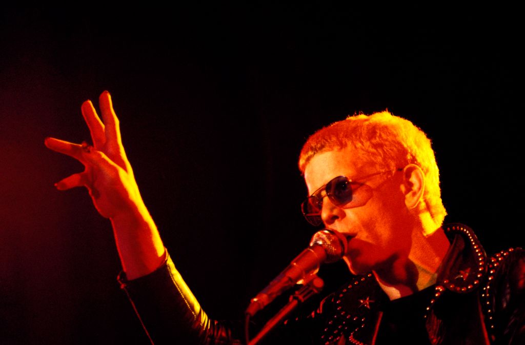 Lou Reed performs live on stage in 1974. (Photo by Gai Terrell/Redferns)