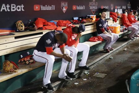 The Washington Nationals react against the Houston Astros during the ninth inning in Game Five of the 2019 World Series at Nationals Park on October 27, 2019 in Washington, DC. (Photo by Rob Carr/Getty Images)