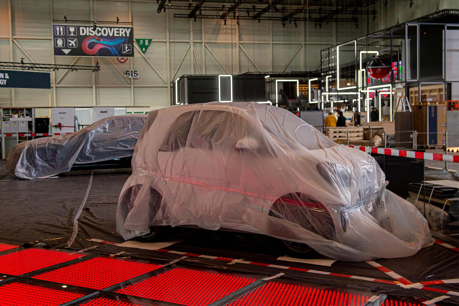 Two cars on the floor of Geneva Motor Show