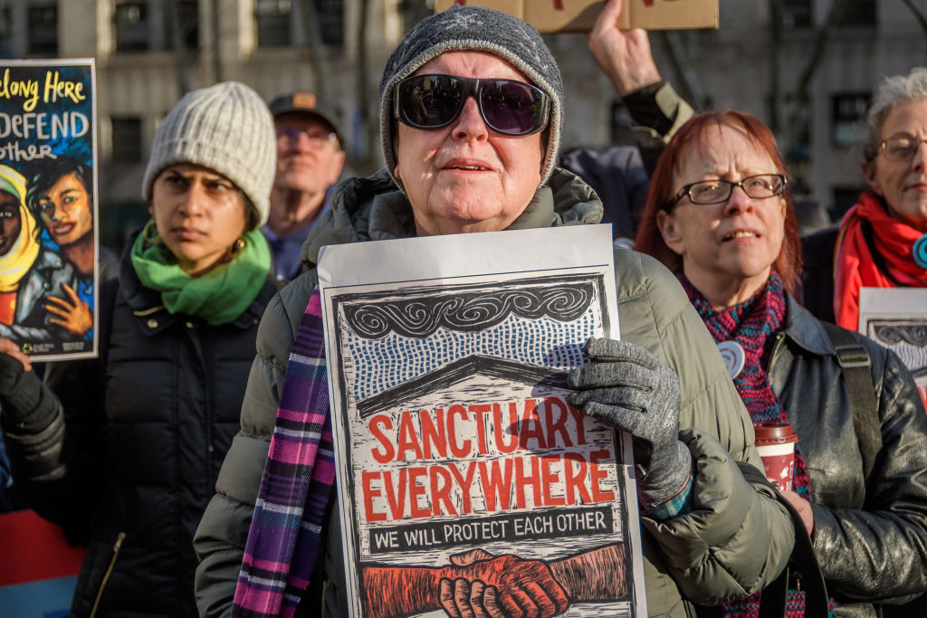 Participant holding a sign at the silent vigil outside ICE court building. Immigration advocacy groups, faith leaders, elected officials and supporters gathered at Foley Square outside the immigration court building at 26 Federal Plaza, in a solidarity action for Ravi Ragbir, New Sanctuary Coalition Director at his U.S. Immigration and Customs Enforcement (ICE) check-in, to speak out against ICEs harassment of immigrant communities and targeting of their leaders. (Photo by Erik McGregor/LightRocket via Getty Images)