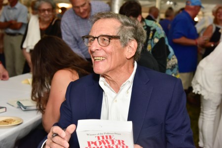 Author Robert Caro with his book "The Power Broker"