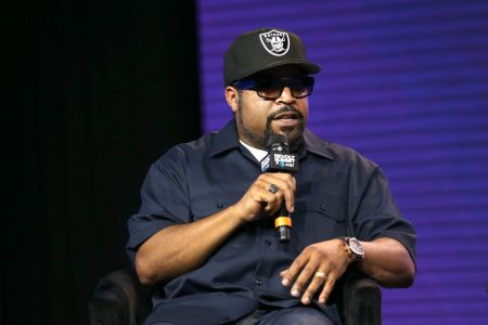 Rapper and actor Ice Cube talking on a microphone