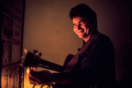 John Prine tunes his guitar in 1972