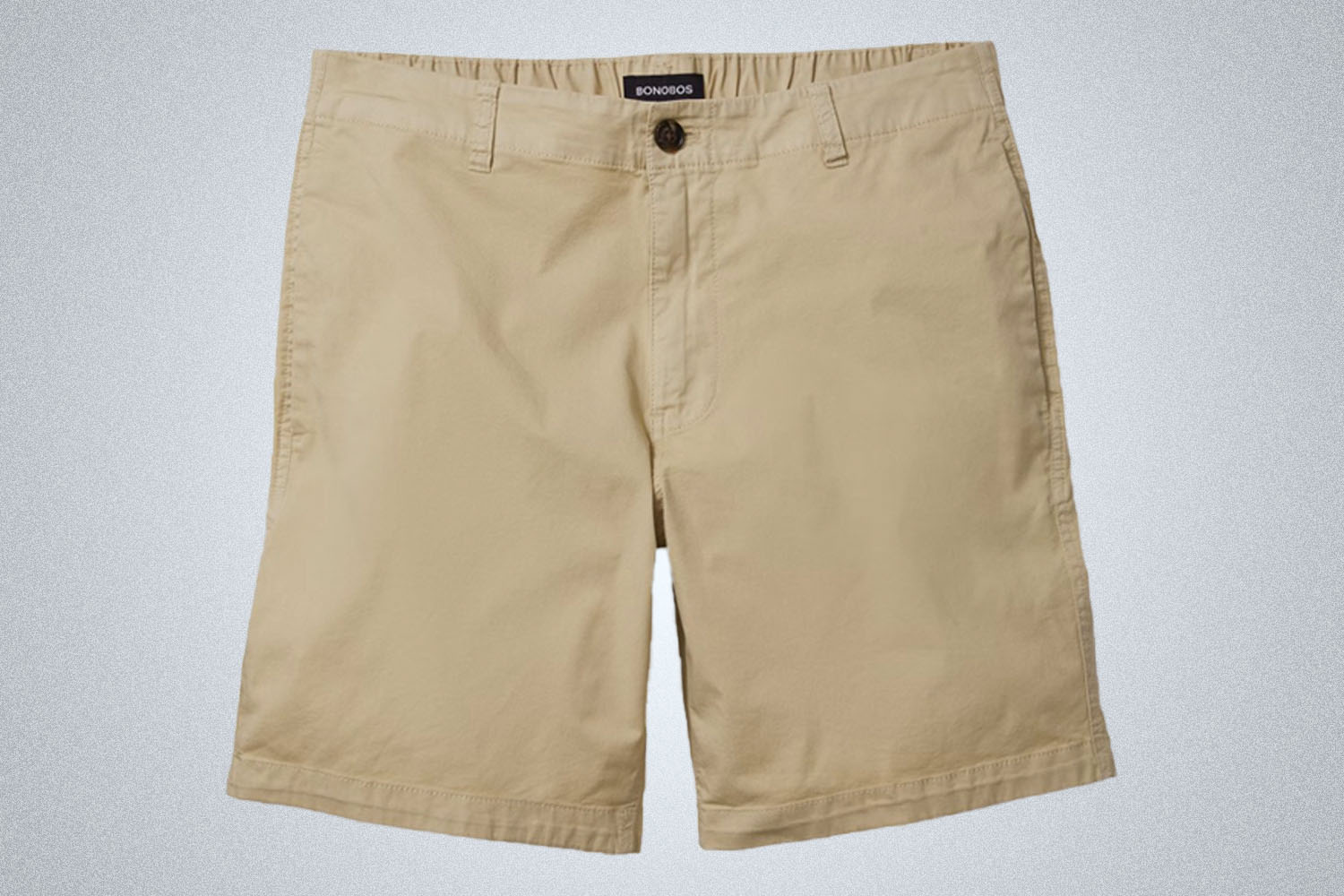 a pair of Bonobos khaki shorts on a grey background