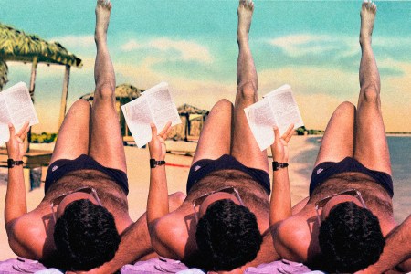 Man reading on the beach during summer