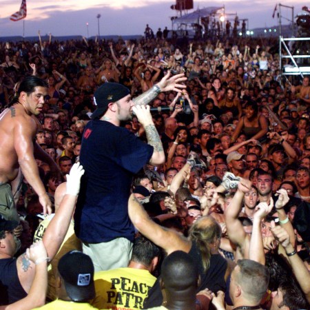 Limp Bizkit's Fred Durst brings his performance to the head of the crowd of the east stage Saturday at Woodstock '99 in Rome, New York