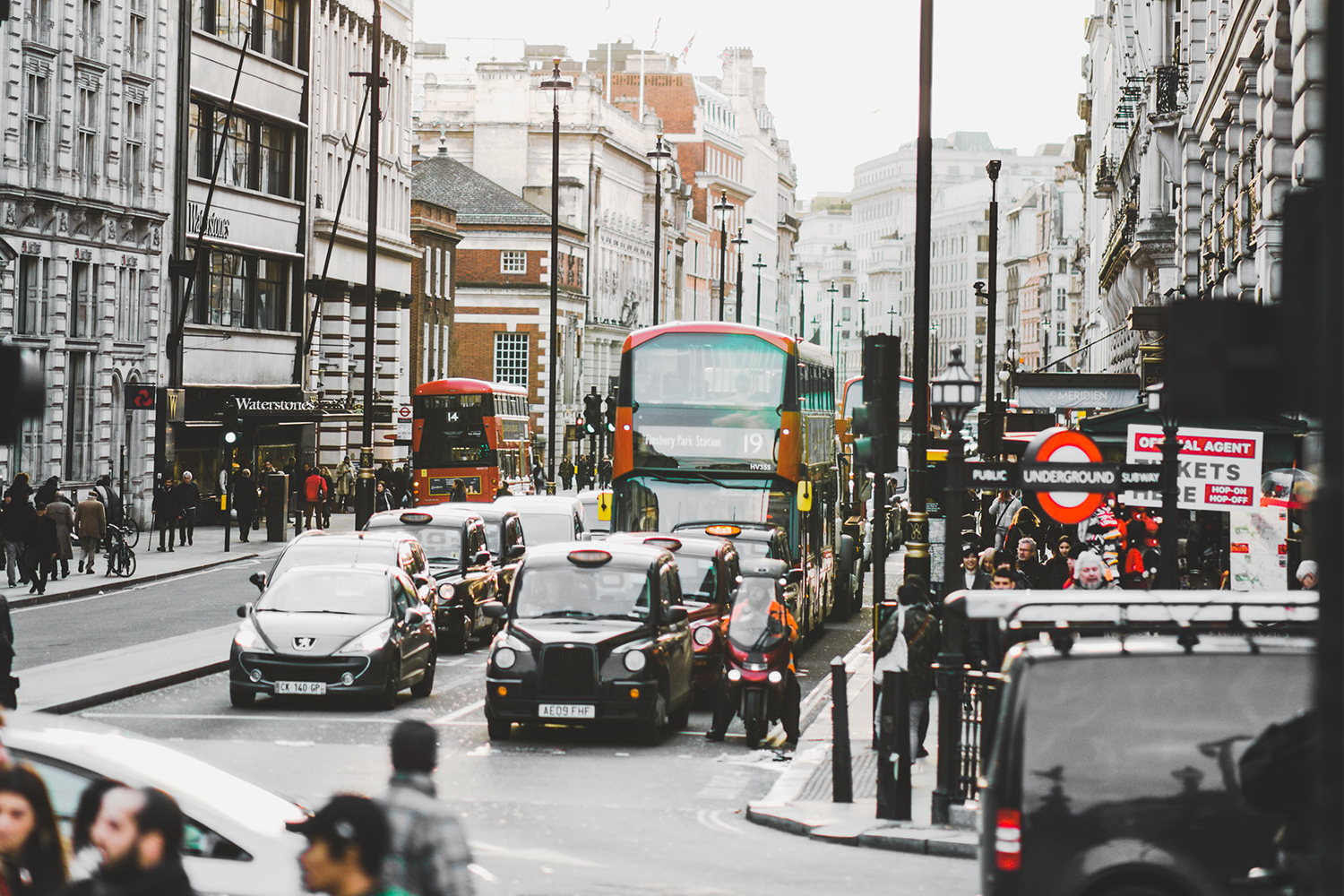 Cars, buses and pedestrians in Leicester Square in London, England