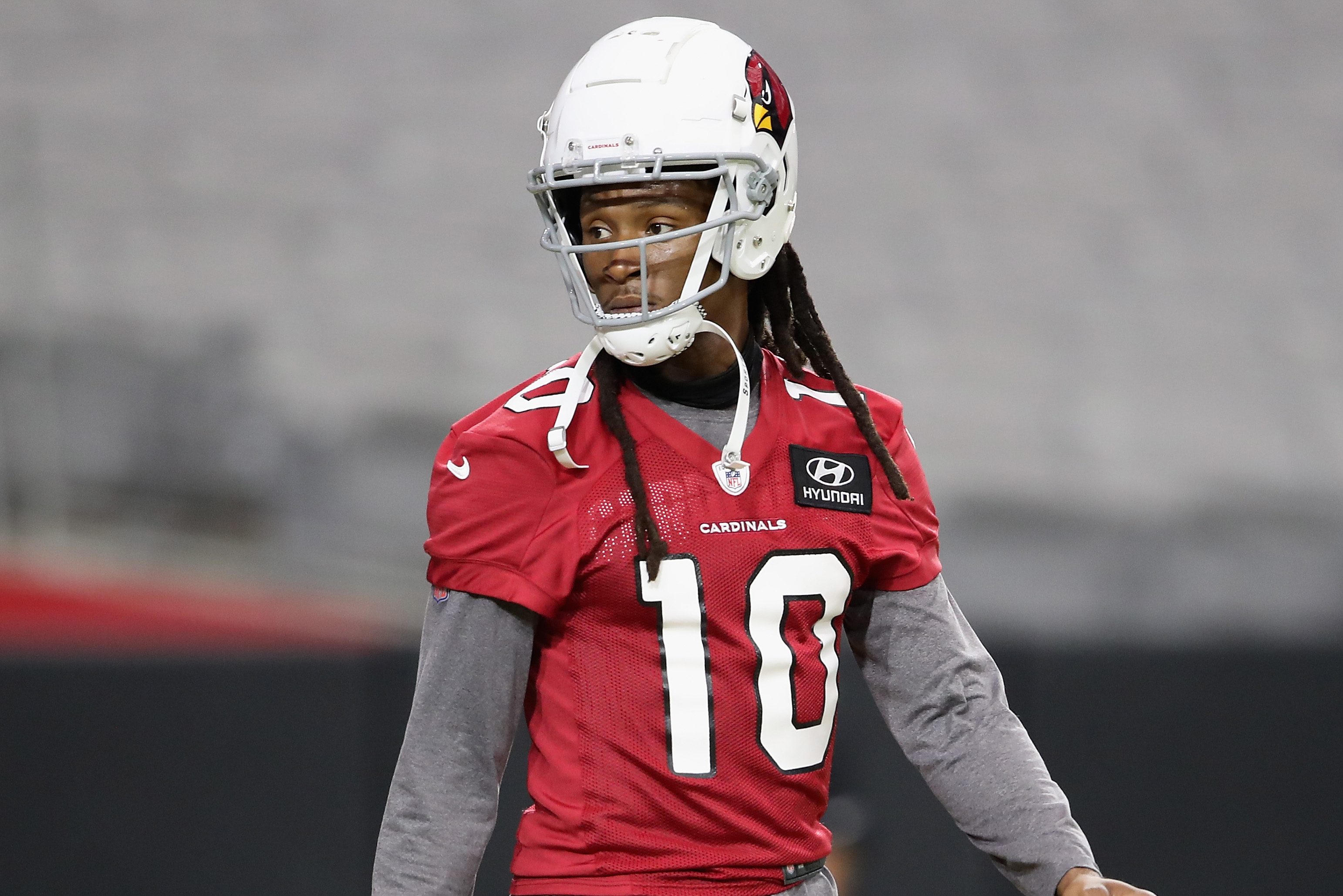 Wide receiver DeAndre Hopkins walks on the field during Cardinals training camp