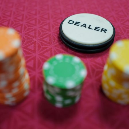 Poker gaming chips stand on a table during a casino training session in France.