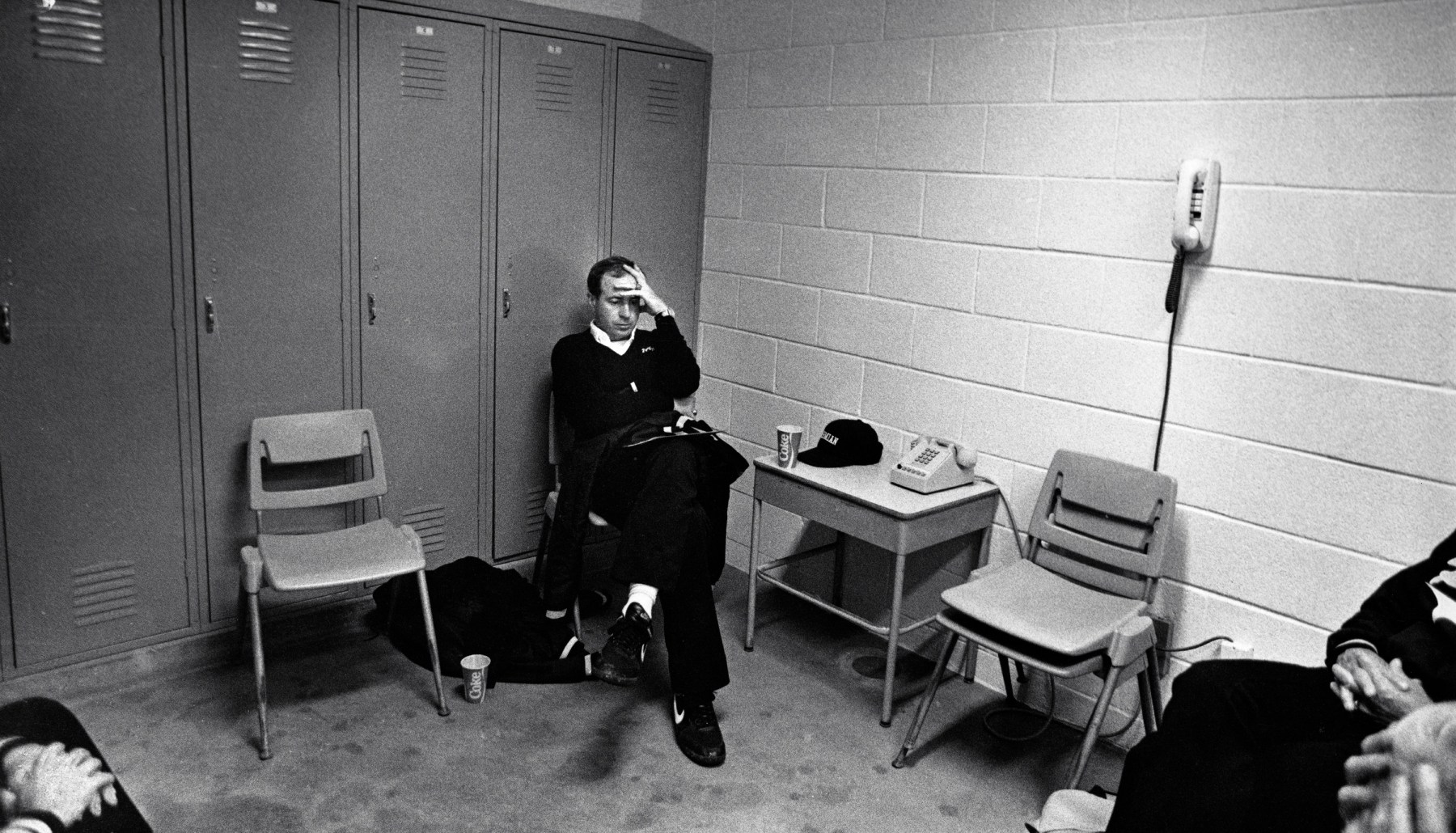 Coach Gary Gaines sits alone in silence following the unexpected loss to Midland Lee.<br><br>“The pressure on the coach, let alone the pressure on the kids, is intense,” Clark says. “I think they lost two games that season. The day after this picture was shot, people put ‘For Sale’ signs in the front yard of his house. So it's like, ‘If you don't win, you're going to move.’ The next year they won a national championship and were undefeated, 16-0. He actually went on to Texas A&M and I think was a backfield coach or something.”