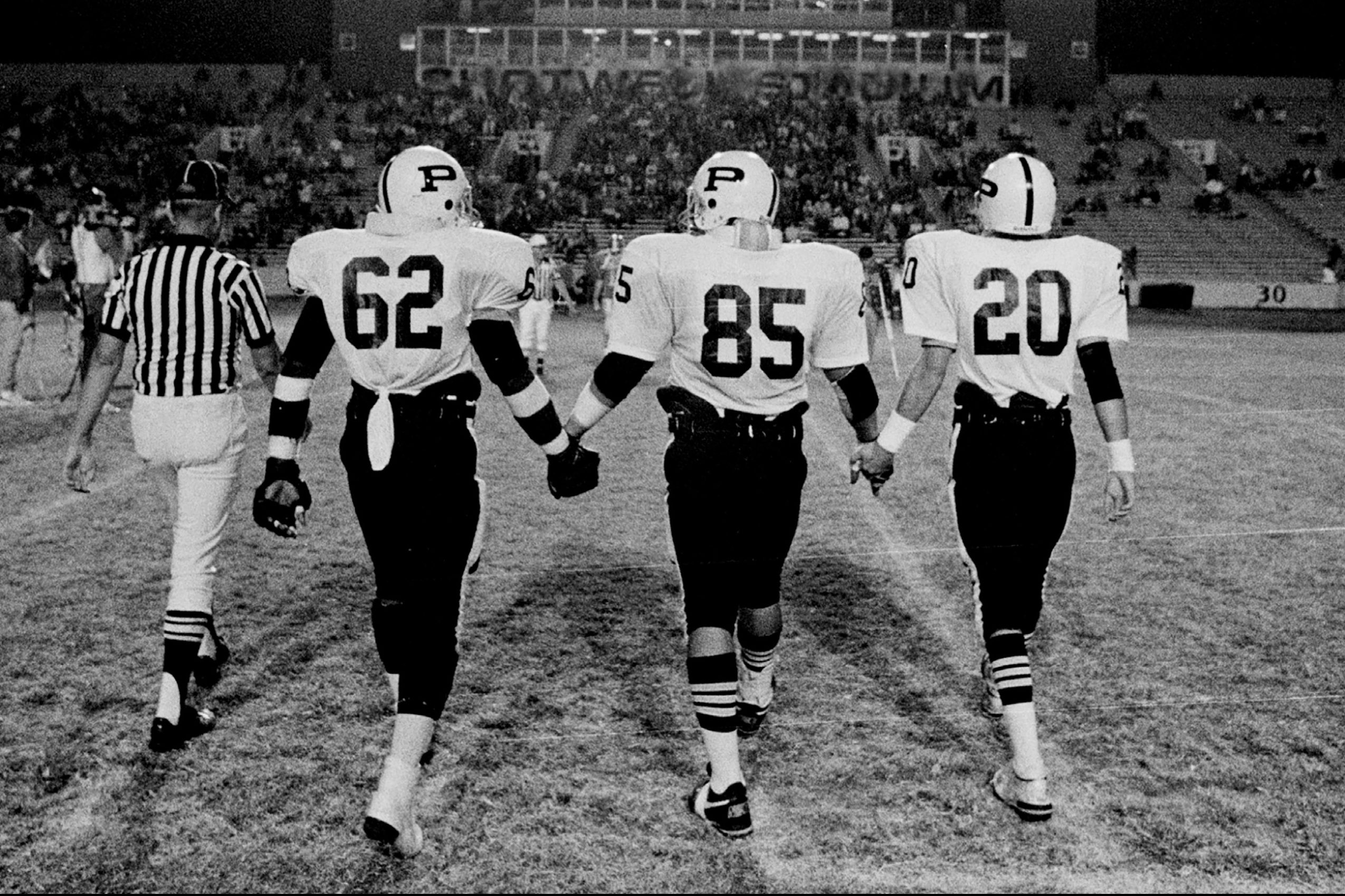 The cover of "Friday Night Lives: Photos from the Town, the Team, and After" by Robert Clark.