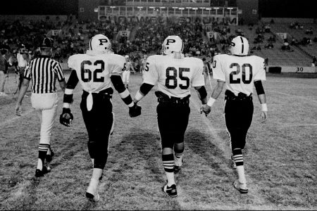 The cover of "Friday Night Lives: Photos from the Town, the Team, and After" by Robert Clark.