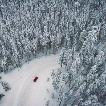 car driving snowy forest